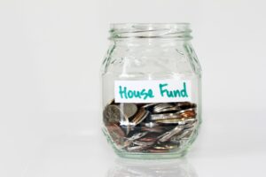jar with coins for house fund